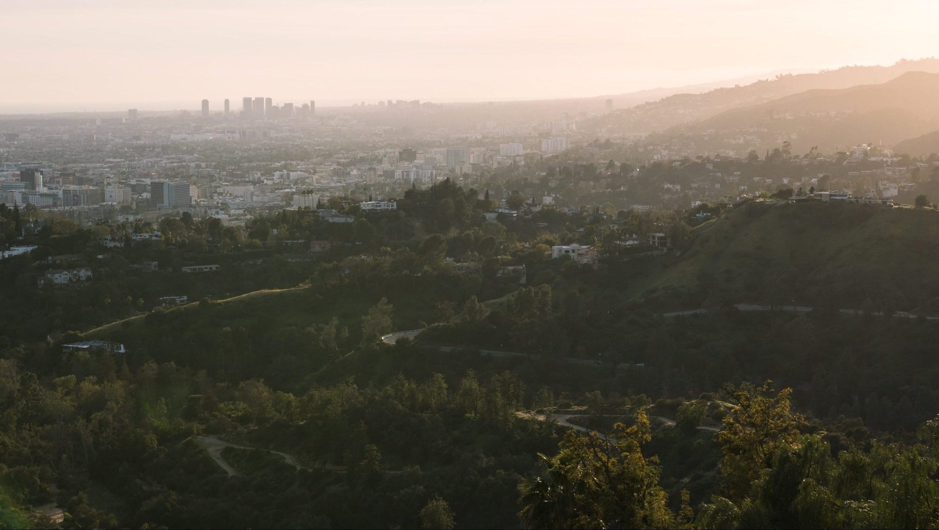 Los Angeles cityscape at golden hour, viewed from the Griffith Park hills